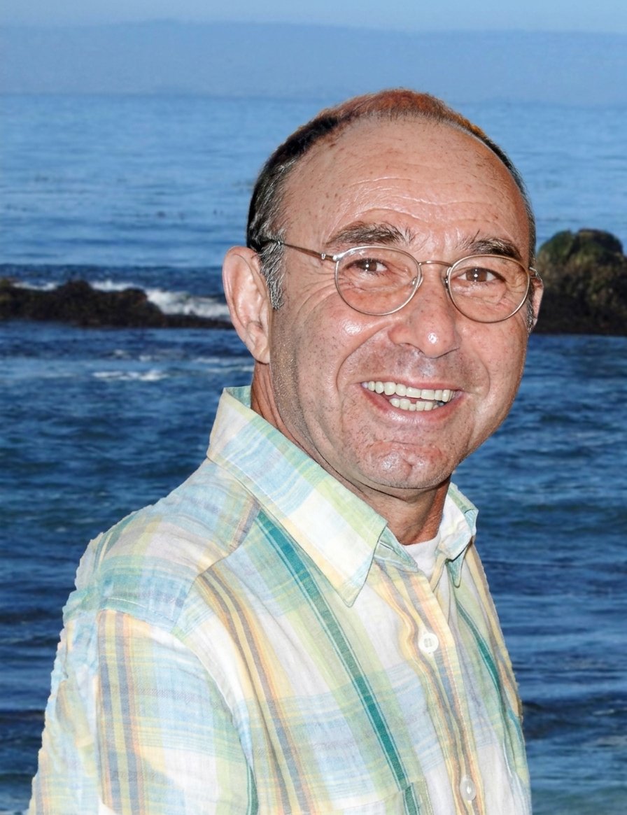Dr. Arthur Faygenholtz smiling by the ocean